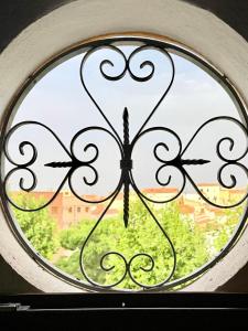 a window with a view of a city at Casa luminosa con encanto in Vélez-Rubio