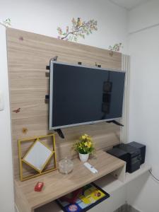 a flat screen tv sitting on top of a shelf at Donde poyito in Sevilla