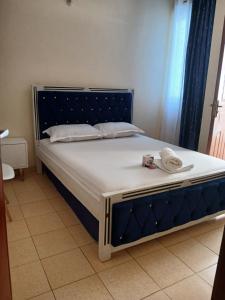 a large bed with a blue and white mattress at Lex homes in Mombasa