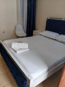 a bed in a room with a large mattress at Lex homes in Mombasa