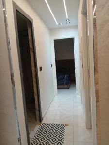 a hallway with a hallway leading to a room at Ikamat raha in Tangier