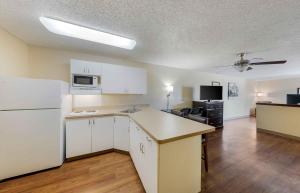 a kitchen with white cabinets and a white refrigerator at Extended Stay America Suites - Los Angeles - Arcadia in Arcadia