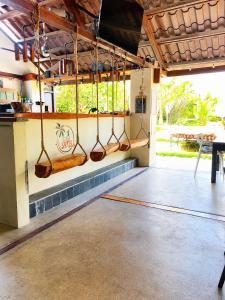 a room with a bunch ofoons hanging from a wall at Casa Swell Coronado, Adults-Only Boutique Hotel, Pool & Beach in Playa Coronado