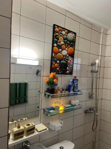 a bathroom with a picture of balls on the wall at La pépite de Joelle in Douala