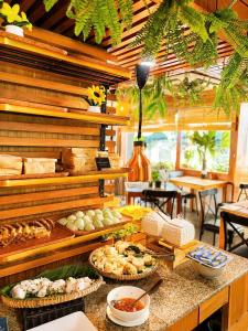 a buffet with various food items on a table at Autumn Sea Boutique Hotel in Nha Trang +55 photos