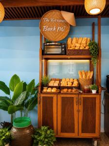 a bakery with a counter with some pastries on it at Autumn Sea Boutique Hotel in Nha Trang