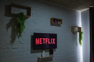 a television on a wall with the words netflix at The Hideaway Studio-Maboneng in Johannesburg