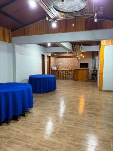 a large room with two blue tables in it at Espaço Luna in Gramado