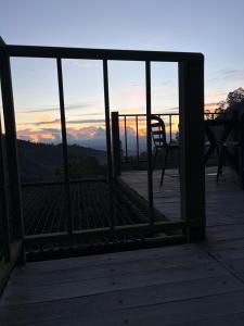 a view of the sunset from a deck at La Photinia in Villamaría