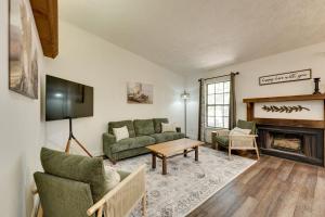 a living room with a couch and a fireplace at Ozark Mountain Refuge in Kimberling City