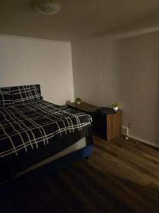 a bedroom with a bed and a desk in it at Cute and Cozy in Hermann I Heliport +6 photos