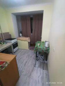an empty room with a table in a room at Gazda ialoveni in Ialoveni