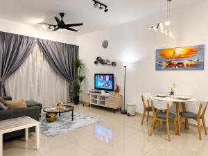 a living room with a couch and a table at Atlantis Residences by UVM Stay -4 Pax in Malacca