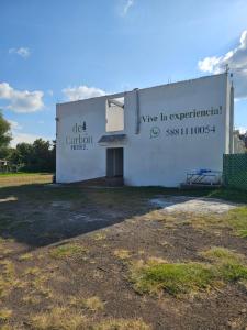 a building with a sign that reads im in experimental unit at Hotel del Carbón in Villa del Carbón
