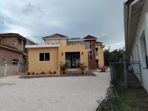 a house with a fence in front of it at Deluxe two 2 bedroom in Priory