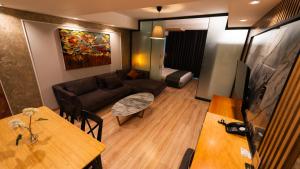 a living room with a couch and a table at Mas Suites Nisantasi in Istanbul