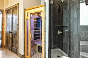 a bathroom with a shower and a tub and a toilet at Million Dollar Mountain Views in Gatlinburg +40 photos