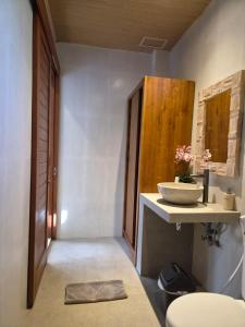 a bathroom with a sink and a bowl on a counter at Lavana Ubud in Ubud +62 photos