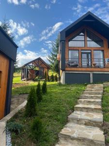 a house with a large window on the side of it at Forest Hills in Yaremche