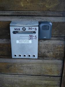an electronic device sitting on top of a wooden wall at Korter in Tartu