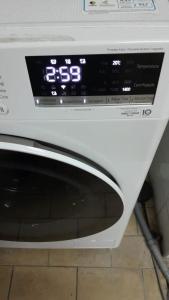 a close up of a white oven with a clock at Rede Quartos in São Paulo