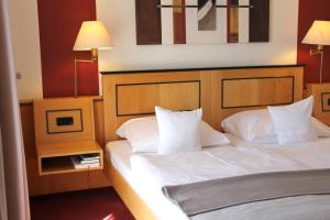 Postel nebo postele na pokoji v ubytování Hotel Riezler Hof