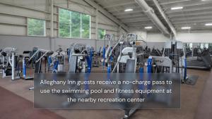 a gym with a lot of treadmills and machines at Alleghany Inn Blue Ridge in Sparta