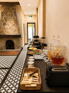 a kitchen with a counter with food and a fireplace at The Mysteri Sapa in Sapa