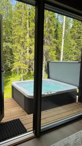a view of a swimming pool from a window at Silencius Cabin With Private Jacuzzi in Rovaniemi