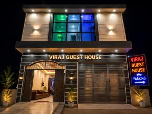 a front view of a virtual guest house at night at Viraj Guest House in Ayodhya