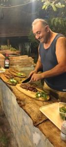 a man is preparing food on a counter at B&B il giardino di Eolo in Pietramelara