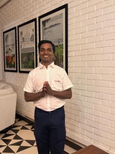 a man in a white shirt is posing for a picture at Casa Mahua, Anjuna Vagator near Beach, with Pvt pool & Garden in Vagator +53 photos