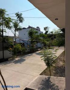 a view of a sidewalk with trees and buildings at Villas La Vista in Tuxpan de Rodríguez Cano