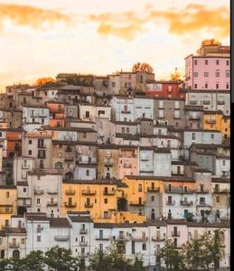 a group of buildings on top of a hill at Placanica Apartment in Calitri