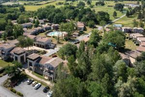 an aerial view of a residential suburb with a pool at Appartement T3 Golf Albret in Barbaste