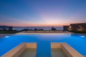 a swimming pool with a blue lighting in a house at Monte Smith Luxury Villas in Rhodes Town