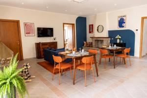 a living room with a table and chairs and a couch at Casa Bottega in San Salvo