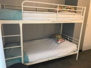 a white bunk bed with a mattress in a room at Auberge De Moricq in Angles