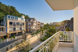 an apartment balcony with a view of a street at Olive Hotel Da Lat in Da Lat