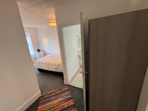 an open door to a bedroom with a bed at kinsale Central Rooms in Kinsale