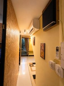 a hallway with a staircase in a room at J Cafe & Hostel in Chiang Mai