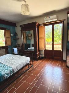 a bedroom with a bed and a mirror on the wall at Ara Solis in Arola
