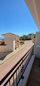 a balcony with a view of a building at Mista apartment in Peyia