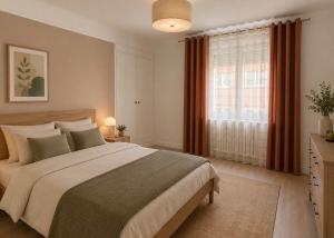 a bedroom with a large bed and a window at Appartement Dunkerque cocooning centre ville in Dunkerque