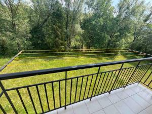 a balcony with a view of a field of grass at Private Apartment in Morshin +3 photos