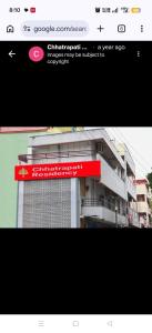 a picture of a building with a red sign at Chhatrapati Residency in Tirupati +2 photos