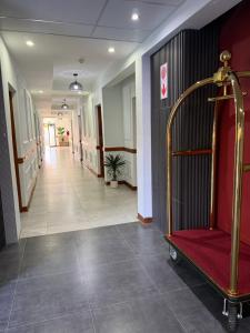 a corridor of a hospital with a corridorngth at The Royal Gem Hotel in Jwaneng