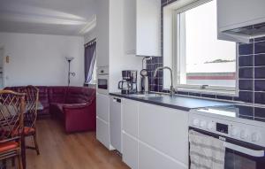 a kitchen with a sink and a counter top at 3 Bedroom Nice Apartment In Sölvesborg in Sölvesborg