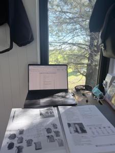 a laptop computer sitting on a table next to a window at plain Bush in Bohena Creek