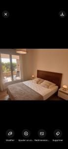 a bedroom with a bed and a window at LES TERRASSES D ACQUACITOSA in SERRA DI FIUMORBO +70 photos